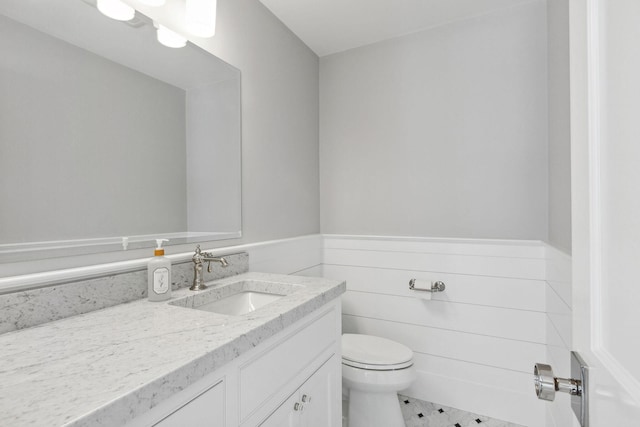 44 Tonset Rd, Orleans, MA 02653 - half bath with toilet, vanity, and wainscoting