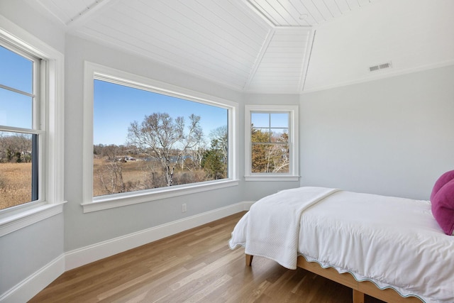 44 Tonset Rd, Orleans, MA 02653 - bedroom featuring visible vents, baseboards, wooden ceiling, wood finished floors, and lofted ceiling