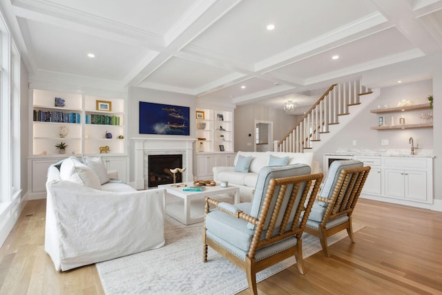 44 Tonset Rd, Orleans, MA 02653 - living room with light wood finished floors, a fireplace, indoor wet bar, and coffered ceiling