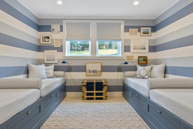 bedroom featuring baseboards, wood finished floors, and recessed lighting