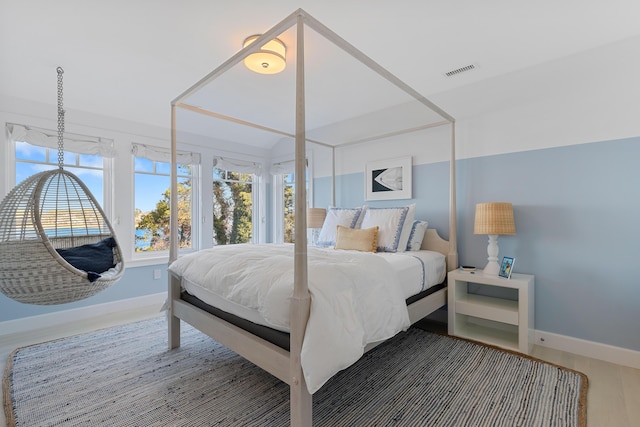 bedroom featuring visible vents and baseboards