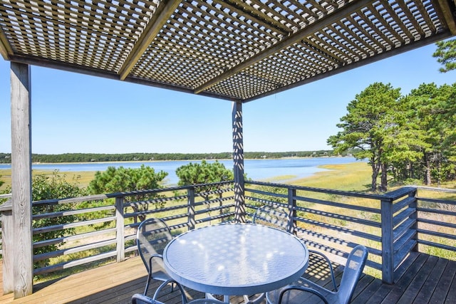 deck with a water view and a pergola