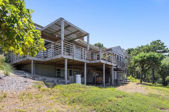 back of property with a wooden deck