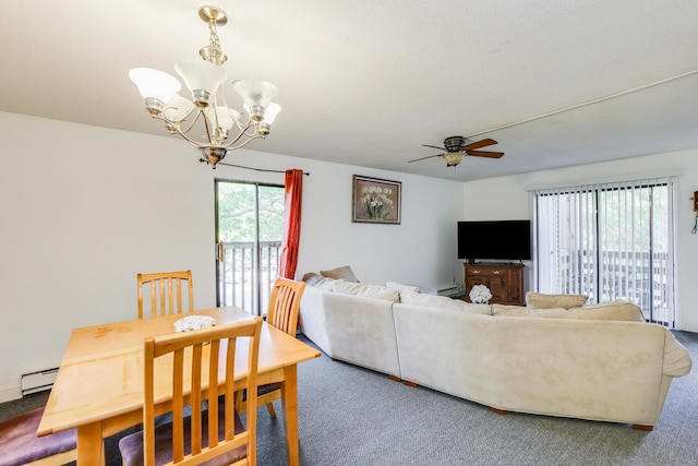 living room with carpet floors, a wealth of natural light, and a baseboard heating unit