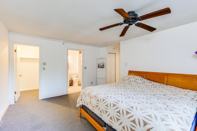 bedroom featuring a textured ceiling, light carpet, a closet, ceiling fan, and ensuite bathroom