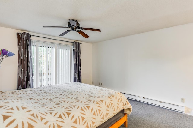 carpeted bedroom with baseboard heating and ceiling fan