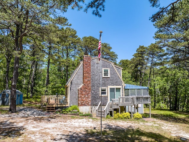 40 Georges Way, Wellfleet, MA 02667 - rear view of property featuring a wooden deck, a chimney, and stairs