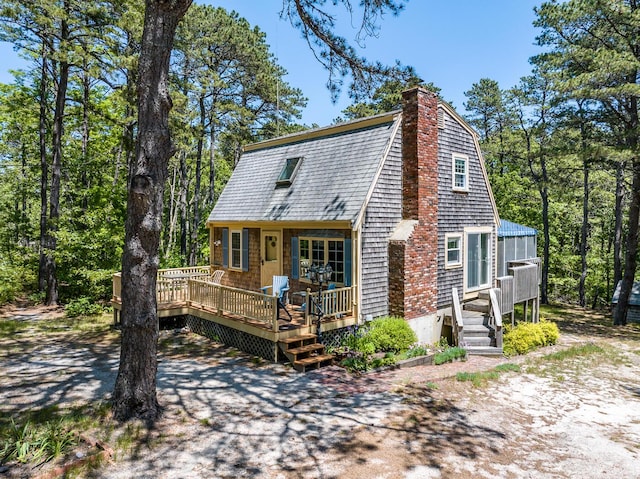 40 Georges Way, Wellfleet, MA 02667 - rear view of house with a deck, a shingled roof, a chimney, and a gambrel roof