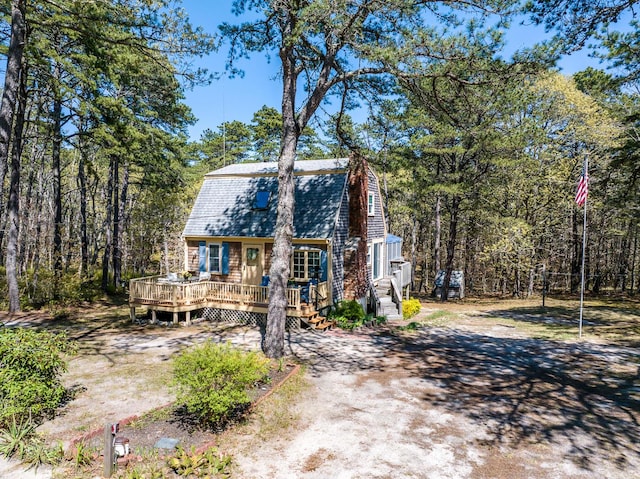40 Georges Way, Wellfleet, MA 02667 - view of front of house featuring a gambrel roof, a wooden deck, and a shingled roof