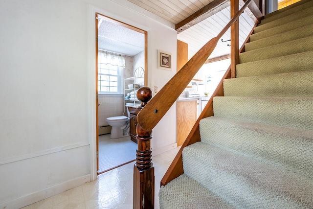 40 Georges Way, Wellfleet, MA 02667 - stairway with a baseboard heating unit, tile patterned floors, beam ceiling, and baseboards