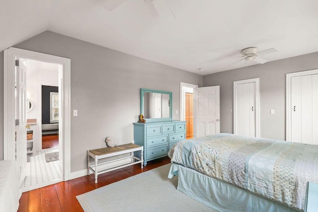 bedroom with lofted ceiling, dark wood-type flooring, and ceiling fan