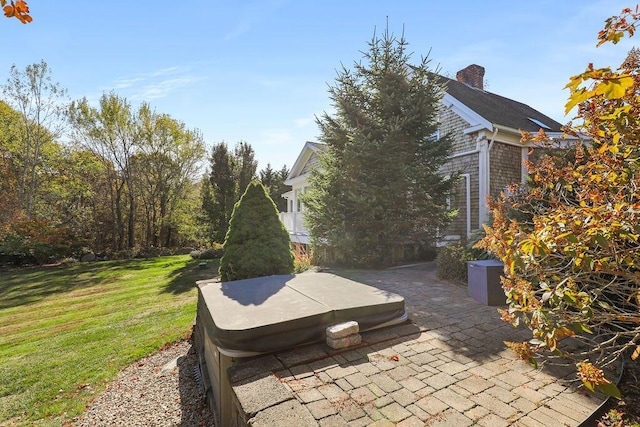 view of patio / terrace with a hot tub