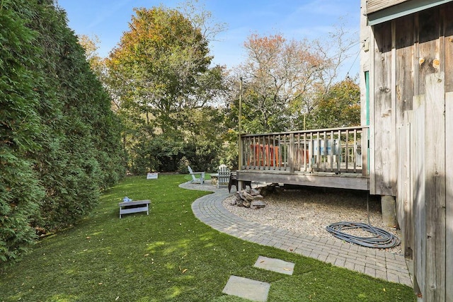 view of yard with a wooden deck