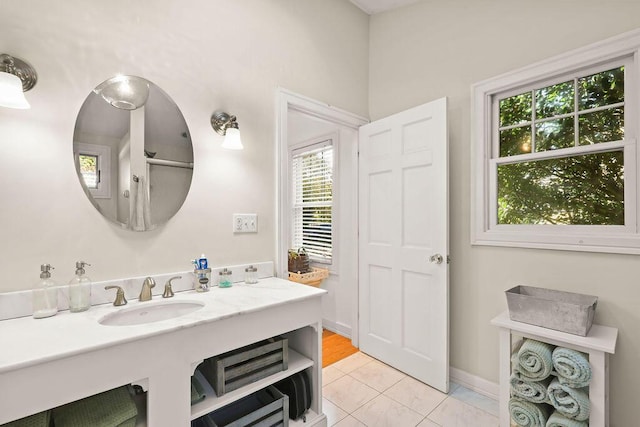 bathroom featuring tile patterned flooring and sink