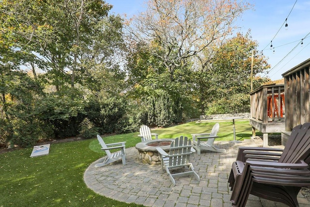 view of patio with a fire pit