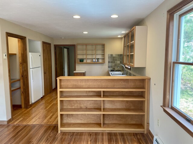 12 Park Ave, Vineyard Haven, MA 02568 - kitchen featuring freestanding refrigerator, open shelves, a sink, wood finished floors, and recessed lighting