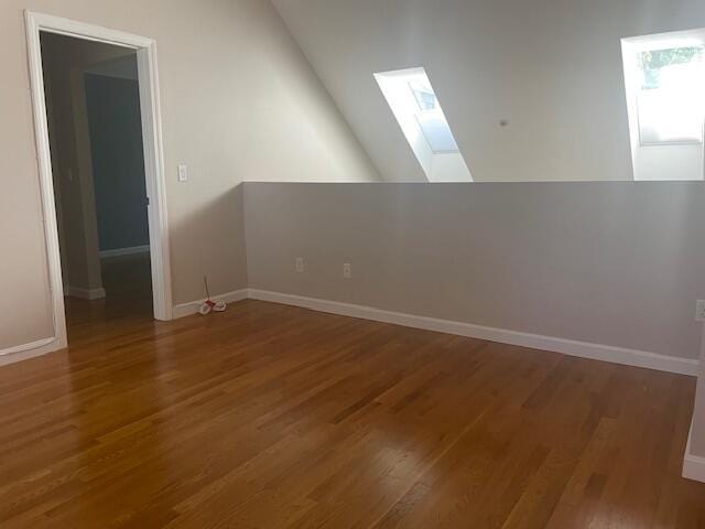 12 Red Cedar Rd, Mashpee, MA 02649 - empty room with a skylight, wood finished floors, and baseboards