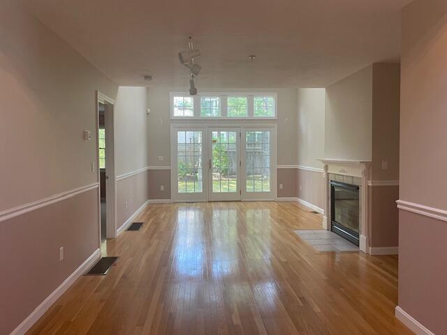 12 Red Cedar Rd, Mashpee, MA 02649 - unfurnished living room featuring a fireplace, light wood finished floors, and baseboards