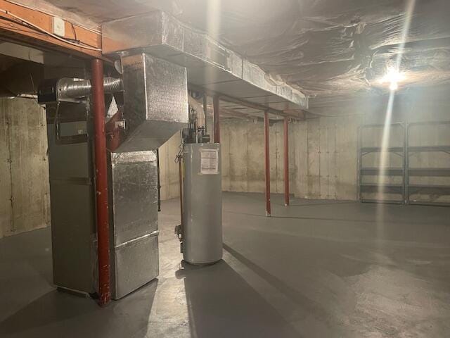 12 Red Cedar Rd, Mashpee, MA 02649 - unfinished below grade area featuring water heater and heating unit