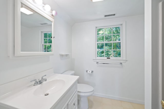 bathroom featuring toilet and vanity