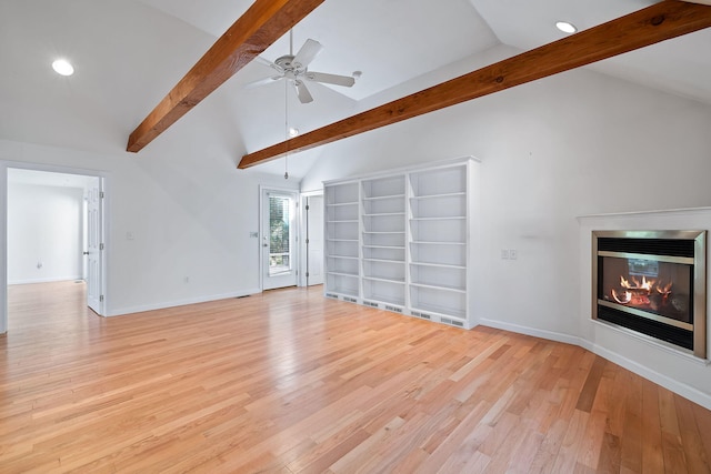 unfurnished living room with ceiling fan, light hardwood / wood-style floors, and lofted ceiling with beams