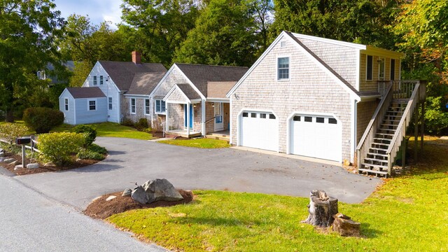 view of front of home with a garage and a front yard