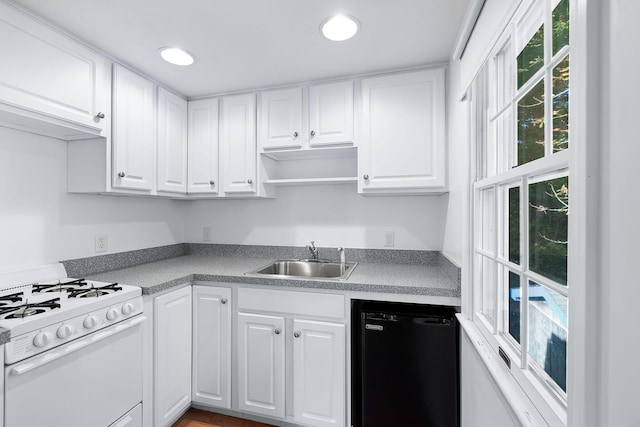 kitchen featuring sink, white cabinetry, white gas stove, and dishwasher