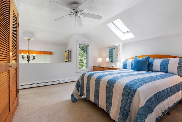 24 Sparrowhawk Rd, Orleans, MA 02653 - carpeted bedroom with a skylight, baseboard heating, vaulted ceiling, and a ceiling fan