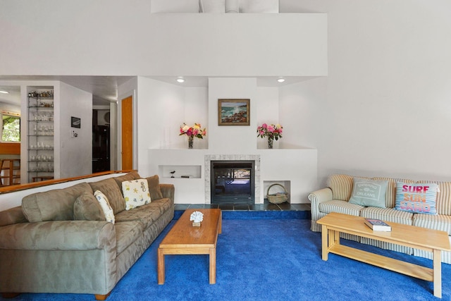 24 Sparrowhawk Rd, Orleans, MA 02653 - carpeted living area featuring a tiled fireplace