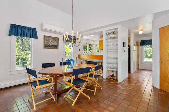 24 Sparrowhawk Rd, Orleans, MA 02653 - dining space featuring a wall mounted AC, a chandelier, dark tile patterned flooring, and a baseboard radiator