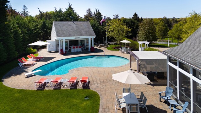 10 Shiverick Rd, East Dennis, MA 02641 - outdoor pool featuring an outdoor structure, a patio area, a storage structure, and a diving board