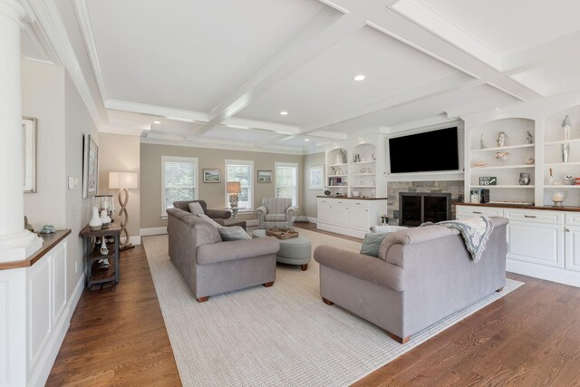 10 Shiverick Rd, East Dennis, MA 02641 - living room featuring wood finished floors, beamed ceiling, ornamental molding, a stone fireplace, and coffered ceiling