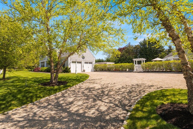 10 Shiverick Rd, East Dennis, MA 02641 - view of side of property featuring a garage and driveway