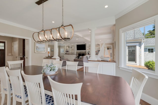 10 Shiverick Rd, East Dennis, MA 02641 - dining area with decorative columns, ornamental molding, recessed lighting, a fireplace, and a chandelier