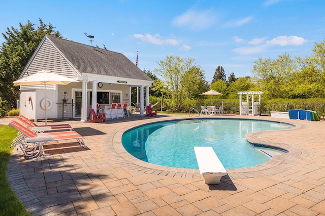 10 Shiverick Rd, East Dennis, MA 02641 - swimming pool with a storage structure, a patio area, an outdoor structure, and a diving board
