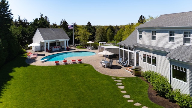 10 Shiverick Rd, East Dennis, MA 02641 - swimming pool with a yard, an exterior structure, a patio area, and an outdoor structure