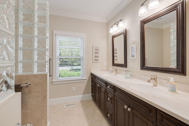 10 Shiverick Rd, East Dennis, MA 02641 - full bathroom with double vanity, tile patterned floors, crown molding, and a tile shower