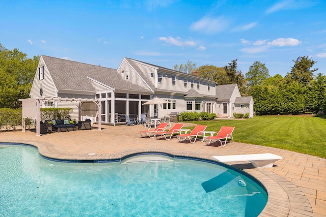 10 Shiverick Rd, East Dennis, MA 02641 - outdoor pool with a sunroom, a patio, a diving board, and a lawn