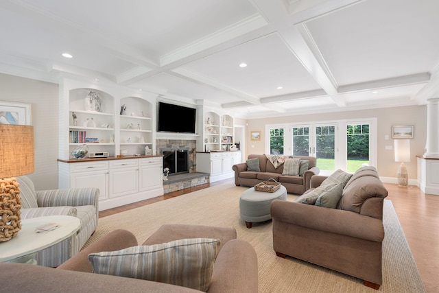 10 Shiverick Rd, East Dennis, MA 02641 - living room featuring light wood-type flooring, beamed ceiling, coffered ceiling, a fireplace, and recessed lighting