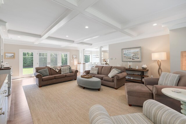 10 Shiverick Rd, East Dennis, MA 02641 - living area with coffered ceiling, beam ceiling, wood finished floors, decorative columns, and crown molding