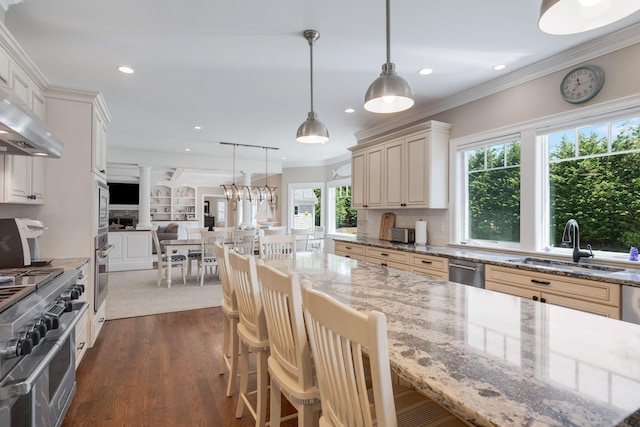 10 Shiverick Rd, East Dennis, MA 02641 - kitchen with ornate columns, open floor plan, stainless steel appliances, recessed lighting, and dark wood-style floors