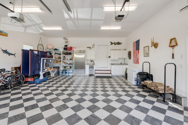 10 Shiverick Rd, East Dennis, MA 02641 - garage featuring built in fridge and a garage door opener