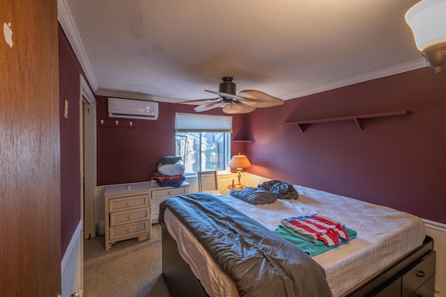 carpeted bedroom featuring crown molding, a textured ceiling, a wall unit AC, and ceiling fan