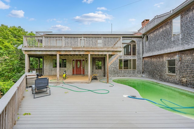 9 Priest Rd, Truro, MA 02666 - wooden deck featuring an outdoor pool and a patio area