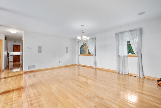 9 Priest Rd, Truro, MA 02666 - unfurnished room featuring a chandelier, healthy amount of natural light, and light wood-style floors