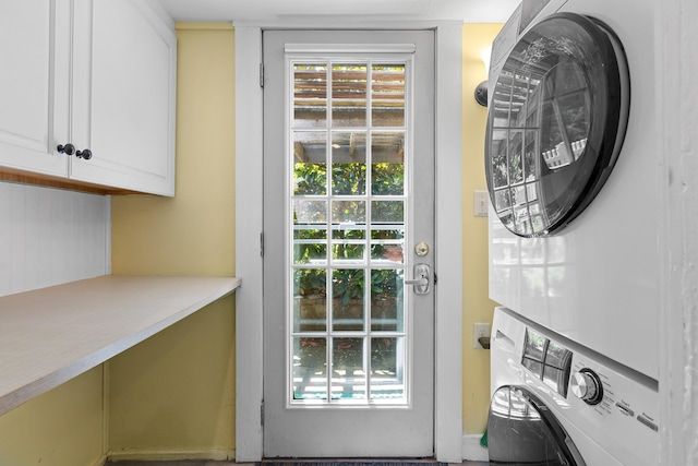 1205 Massasoit Rd, Eastham, MA 02642 - laundry room featuring estacked washer and dryer and cabinet space