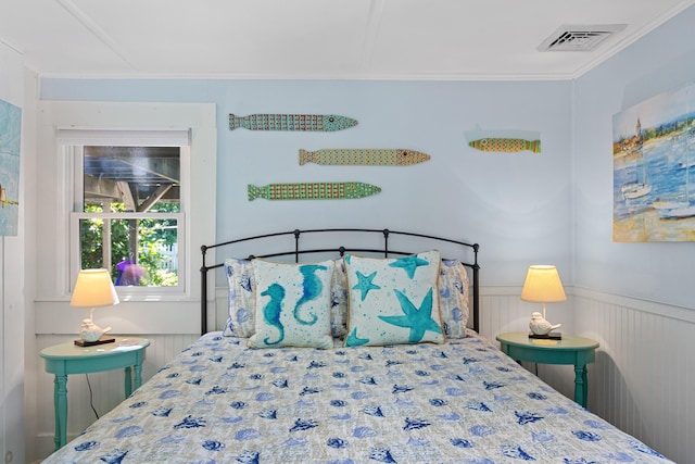 1205 Massasoit Rd, Eastham, MA 02642 - bedroom with wainscoting and crown molding