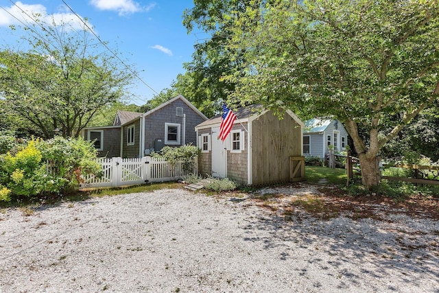1205 Massasoit Rd, Eastham, MA 02642 - view of front of home featuring a storage shed and a gate