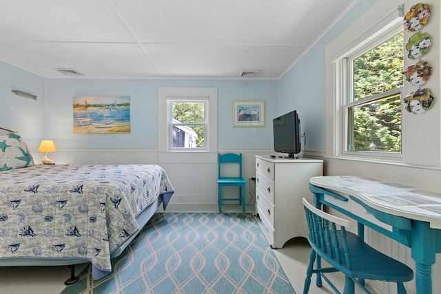 1205 Massasoit Rd, Eastham, MA 02642 - bedroom with a wainscoted wall and crown molding