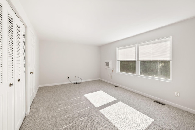 63 Pine Valley Dr Unit 63Aka 30A, Falmouth, MA 02540 - unfurnished bedroom featuring carpet, a closet, and a wall mounted air conditioner
